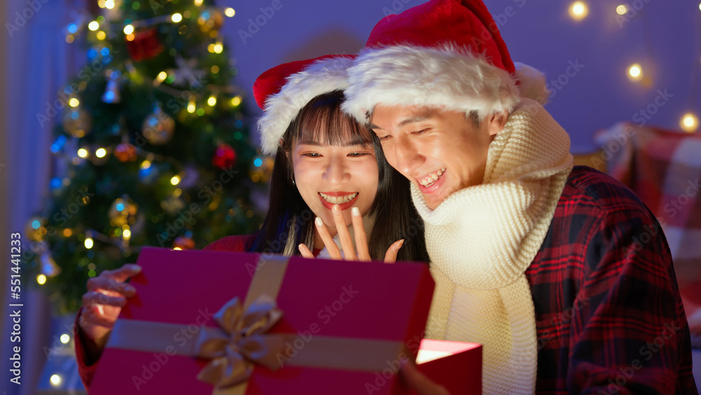 Asian couple open present box