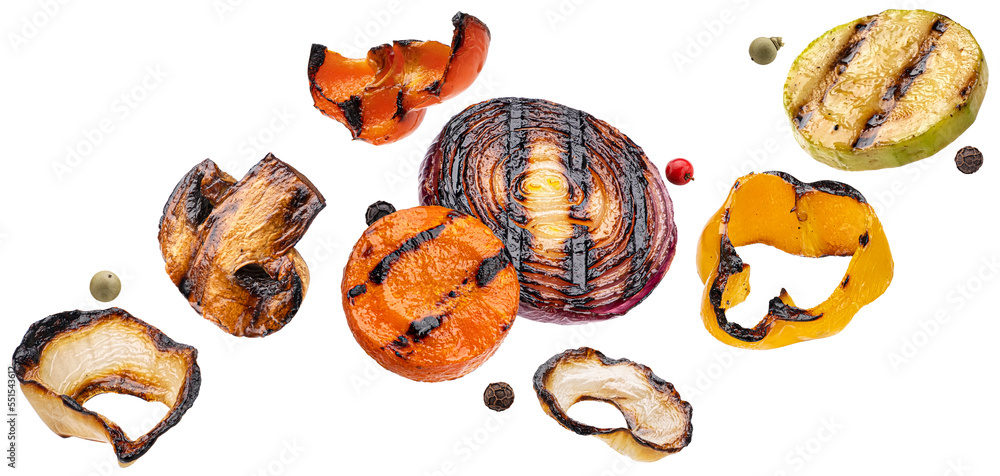 Falling grilled vegetable slices isolated on white background