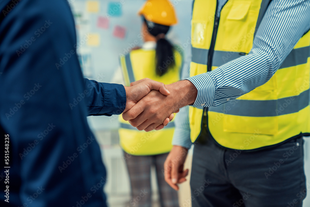 After concluding the meeting, competent investor shakes hands with engineer. Concept of the agreemen