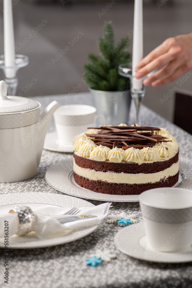 Festive served Christmas table with cake. Family tea party for christmas and new year. Dining table 