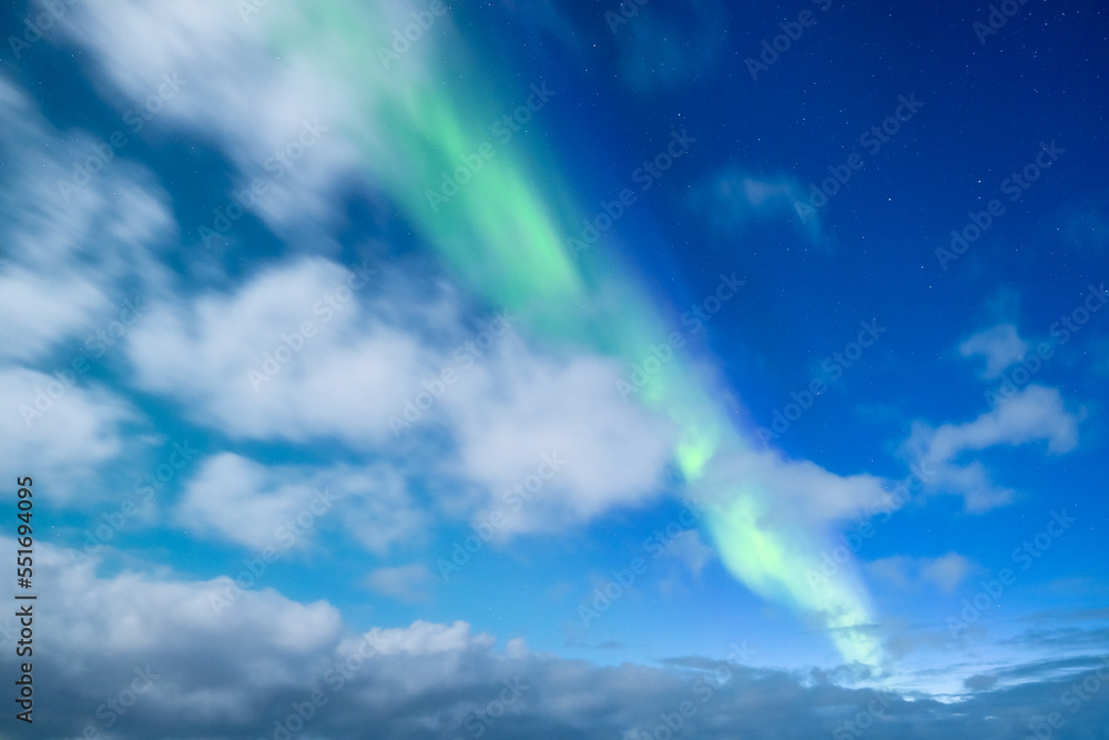 Aurora Borealis. Northern Lights as a background. A winter night landscape with bright lights in the