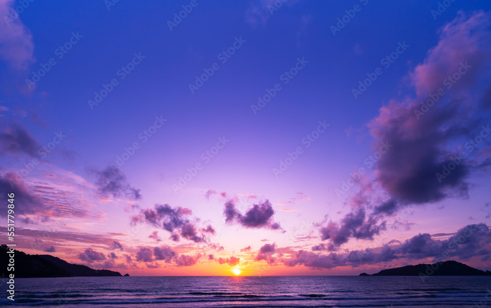 Landscape Long exposure of majestic clouds in the sky sunset or sunrise over sea with reflection in 