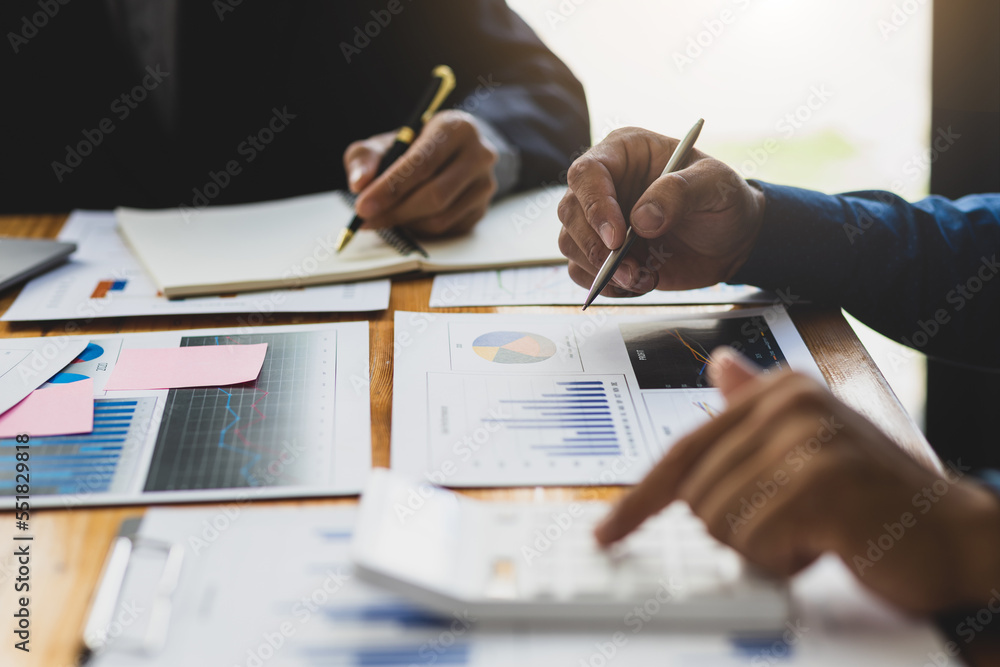 Businessman meeting and working with financial report for analysis data figures to plan business str