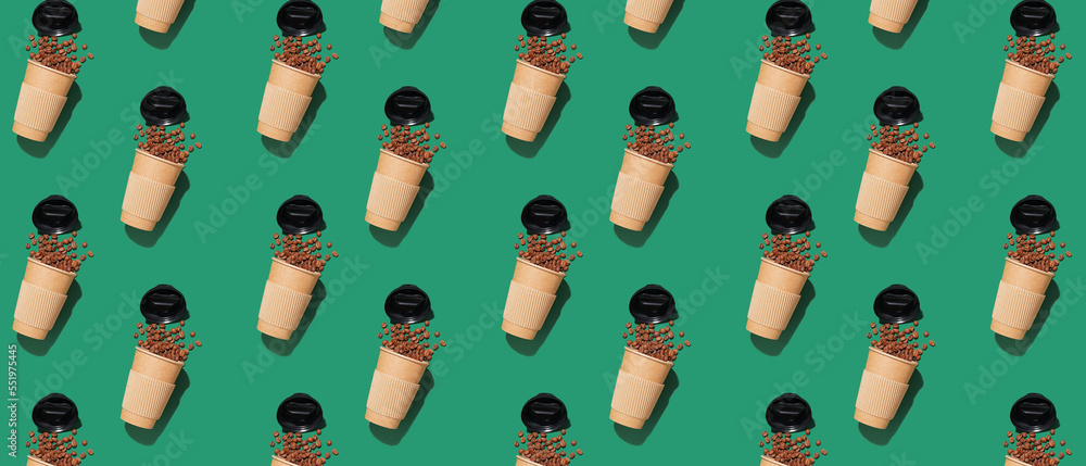 Many paper cups and coffee beans on red background