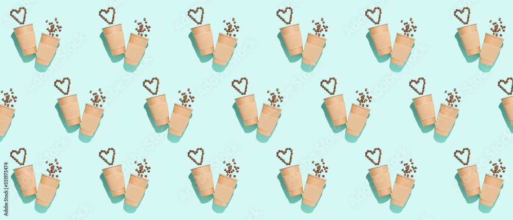 Many paper cups and coffee beans on light blue background