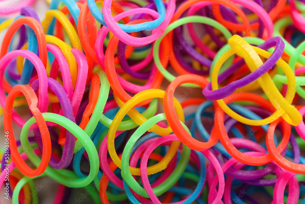 Colorful office rubber bands as background, closeup