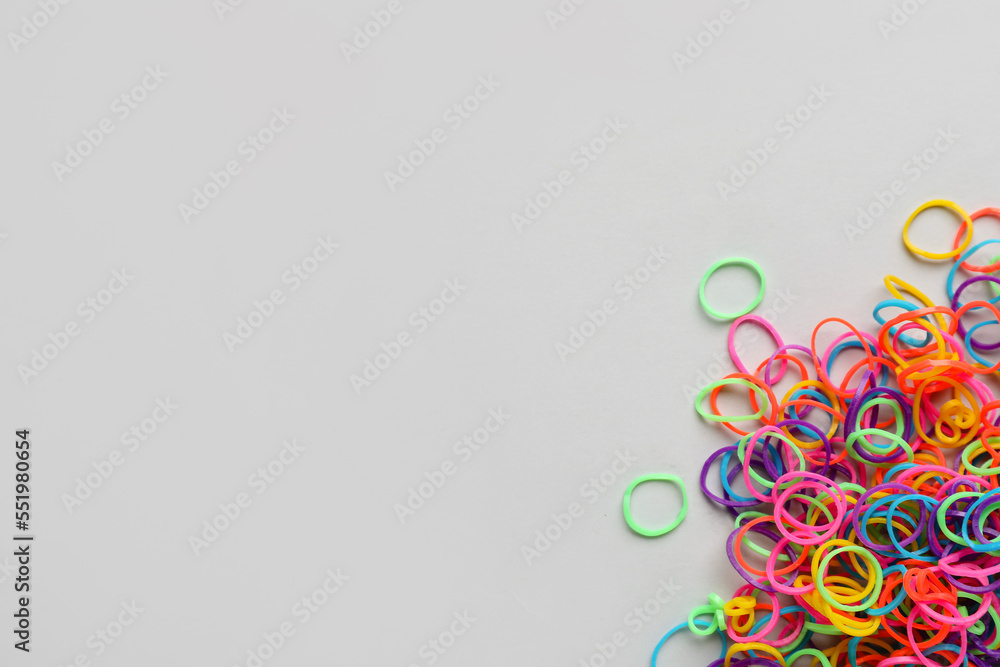 Heap of office rubber bands on white background