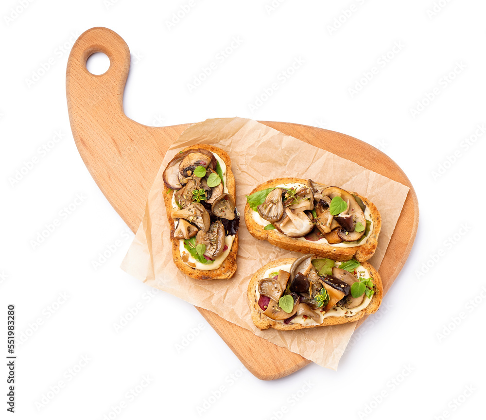 Wooden board of tasty toasts with cream cheese and mushrooms on white background