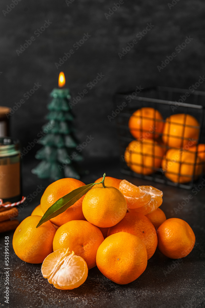 Heap of fresh ripe tangerines on dark background