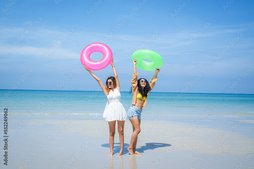 Happy female friends enjoy and fun outdoor activity lifestyle on holiday travel vacation at the sea.