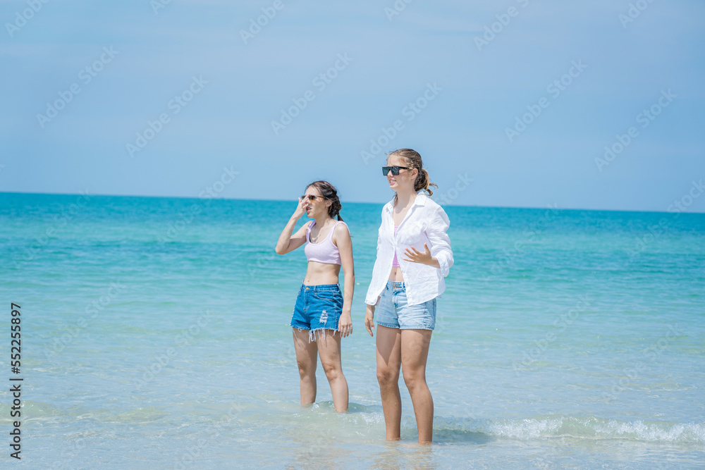 Group of friends having fun at the beach on holidays,Holiday in summer,Concept vacation.