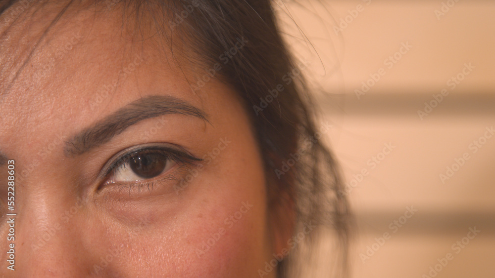 CLOSE UP, PORTRAIT: A detailed look at the beautiful brown eye of a Filipina