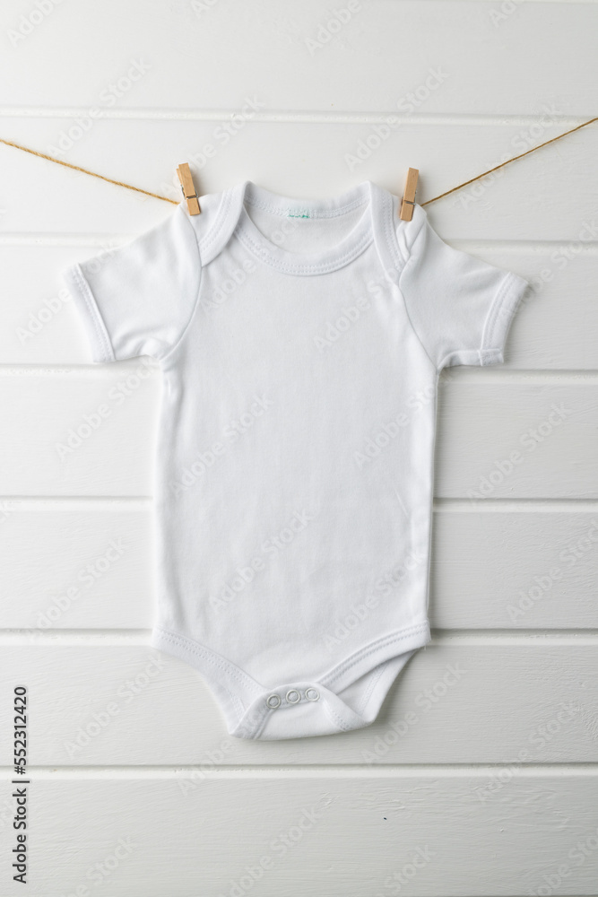 Close up of baby white t shirt with copy space on white background