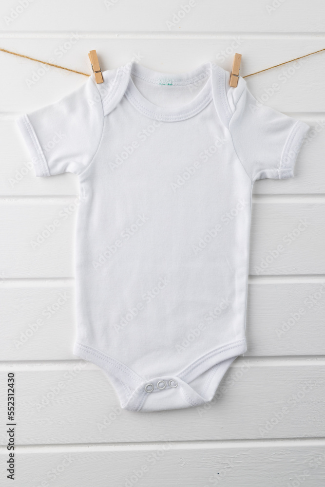 Close up of baby white t shirt with copy space on white background