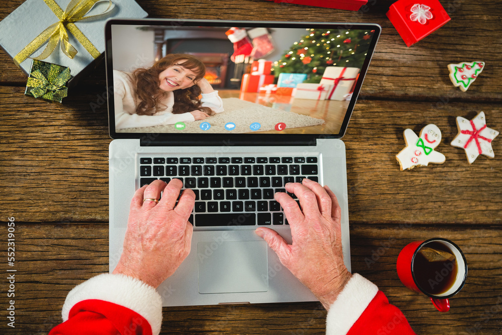 Senior caucasian man having christmas video call with caucasian woman