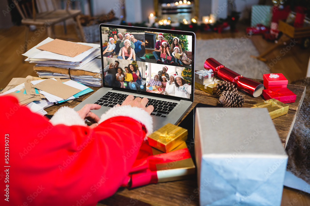 Senior caucasian man having christmas video call with diverse people