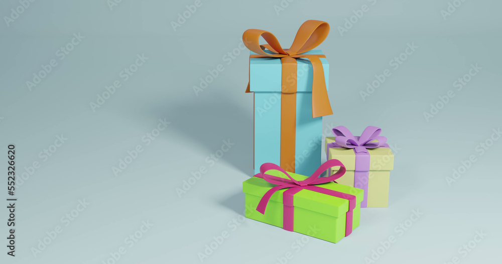 Image of three christmas presents spinning with copy space over grey background