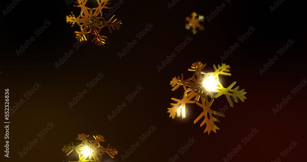 Image of gold snowflakes falling over black background