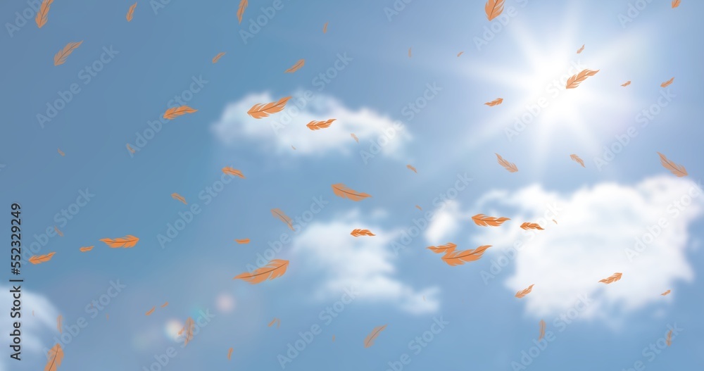 Digital composite of orange feathers flying against clouds and bright sun in sky, copy space