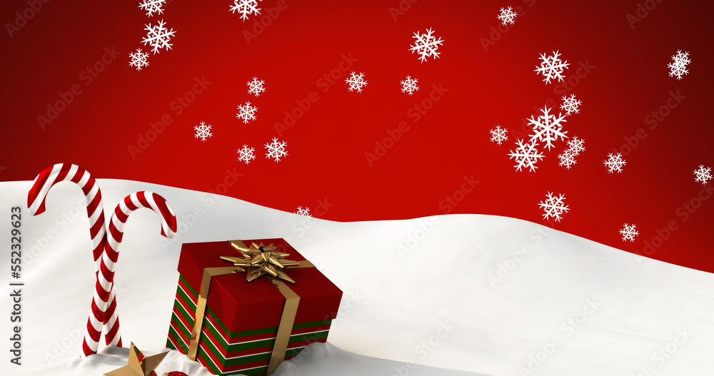 Image of snow falling over candy canes and christmas present on red background