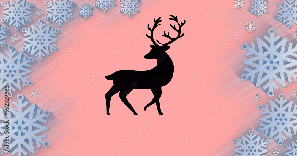 Image of reindeer over snow falling