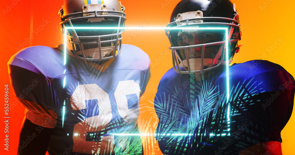 Multiracial american football players wearing helmets standing by illuminated square and plants