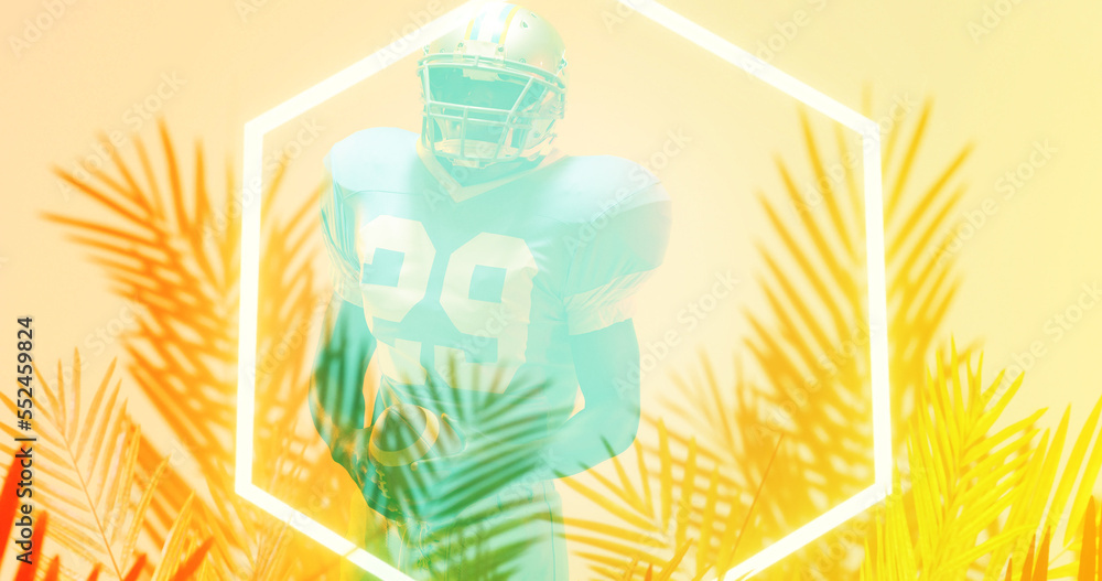 Composite of american football player standing by illuminated hexagon and plants on beige background