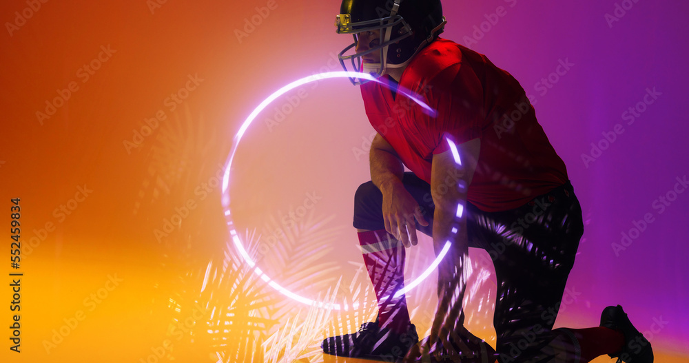 Composite of american football player wearing helmet kneeling by illuminated circle and plants