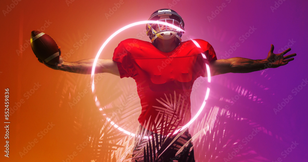 Composite of american football player with arms outstretched by illuminated circle and plants