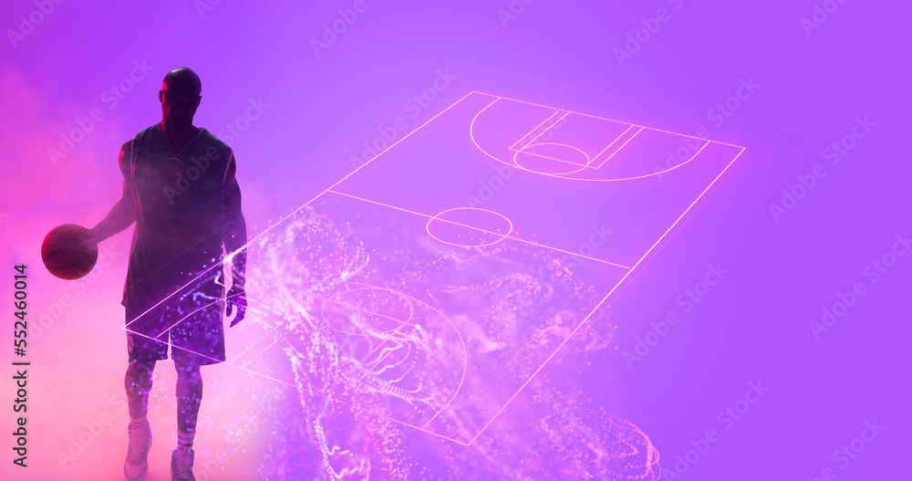 Composite of african american player with ball standing by illuminated basketball court , copy space