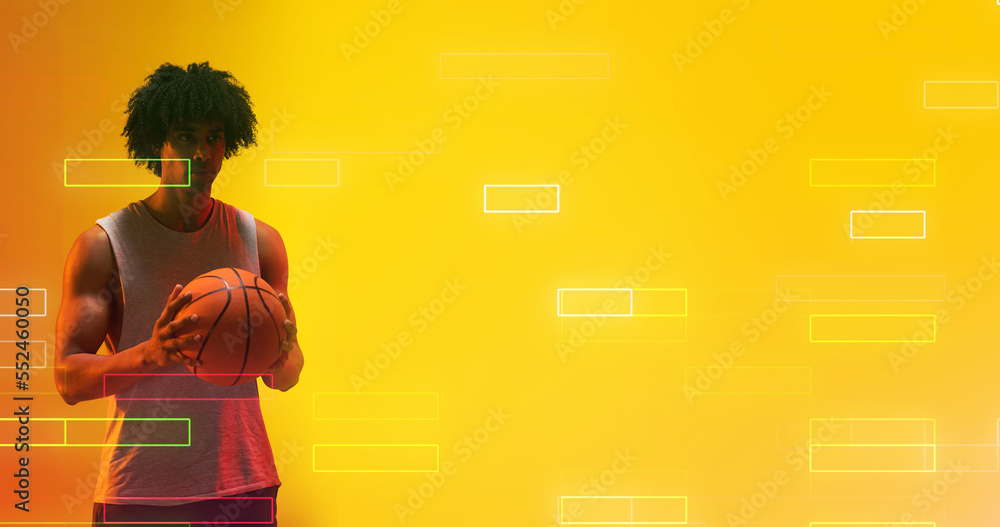 Composite of biracial male player holding basketball by illuminated rectangles on yellow background