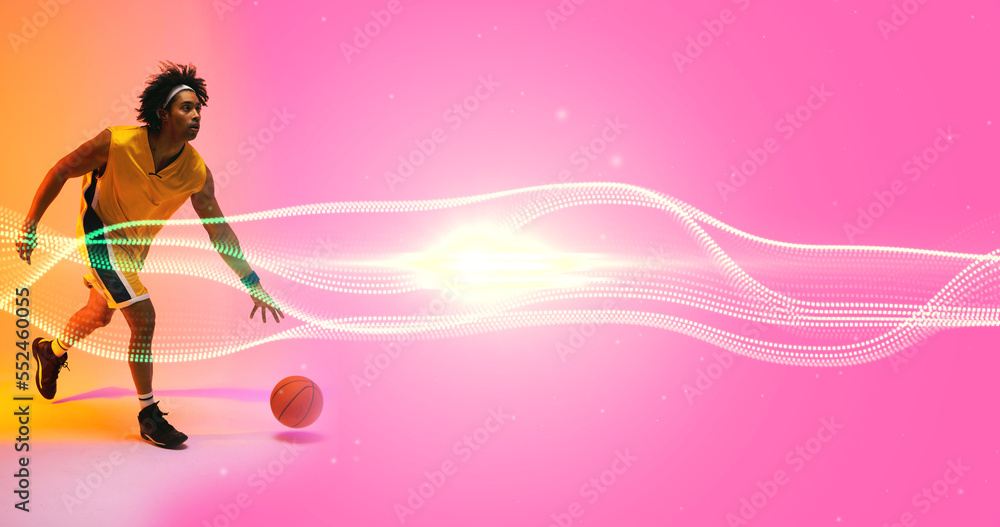 Composite of biracial male player playing with ball by illuminated wave pattern on pink background