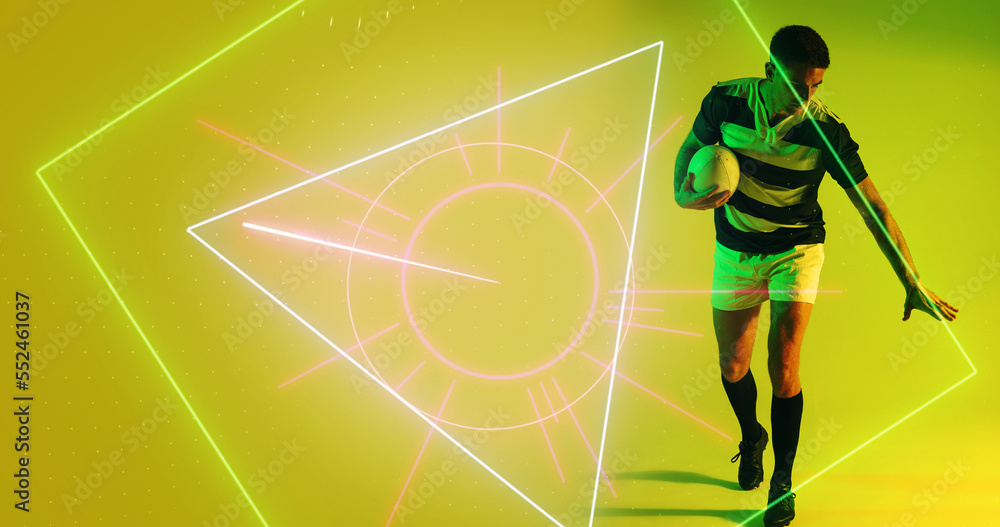 Caucasian male player with rugby ball standing over illuminated geometric shape on yellow background