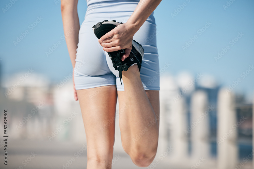 Woman, stretching legs and back view in city, street or urban road outdoor. Fitness, health and fema