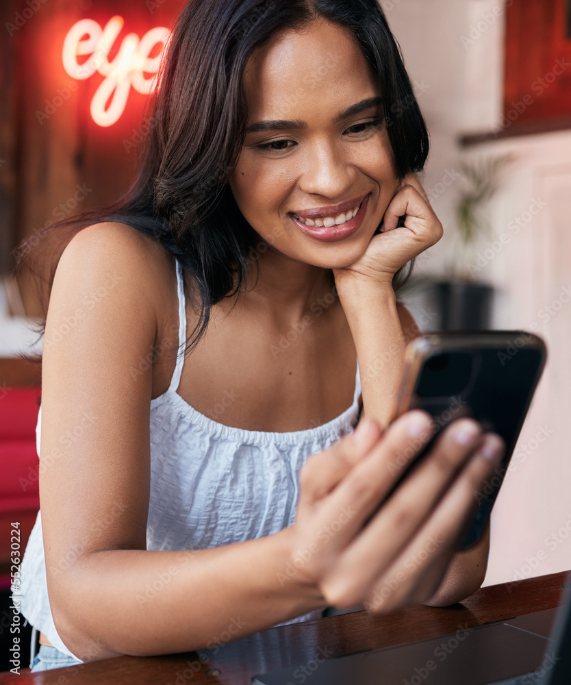 Phone, social media and communication with a black woman in a coffee shop or internet cafe to relax 