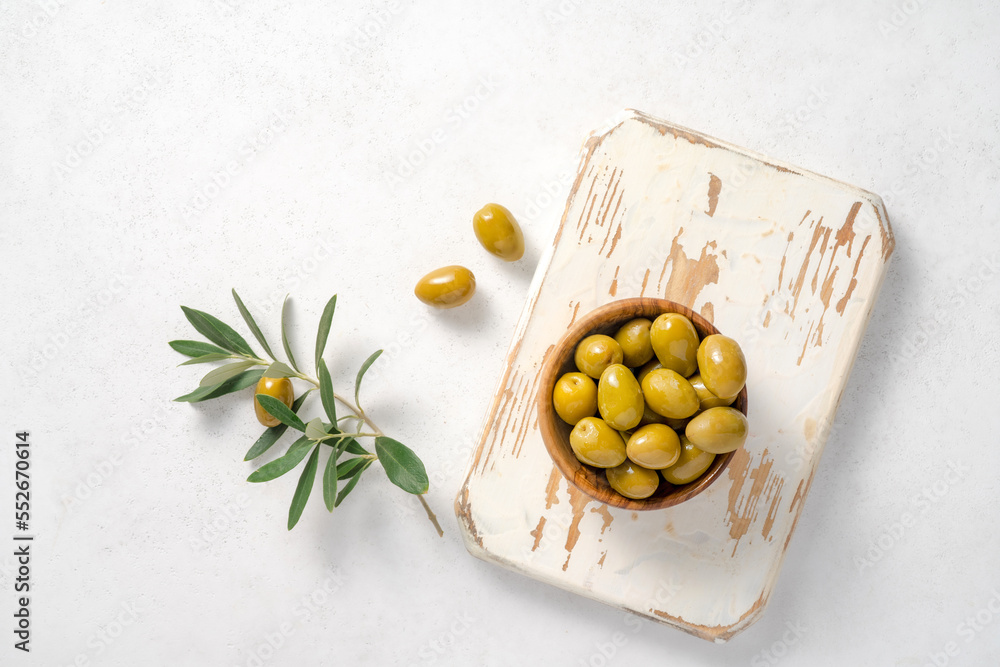 Fresh olives on white wooden board. Mockup for package. Copy space.