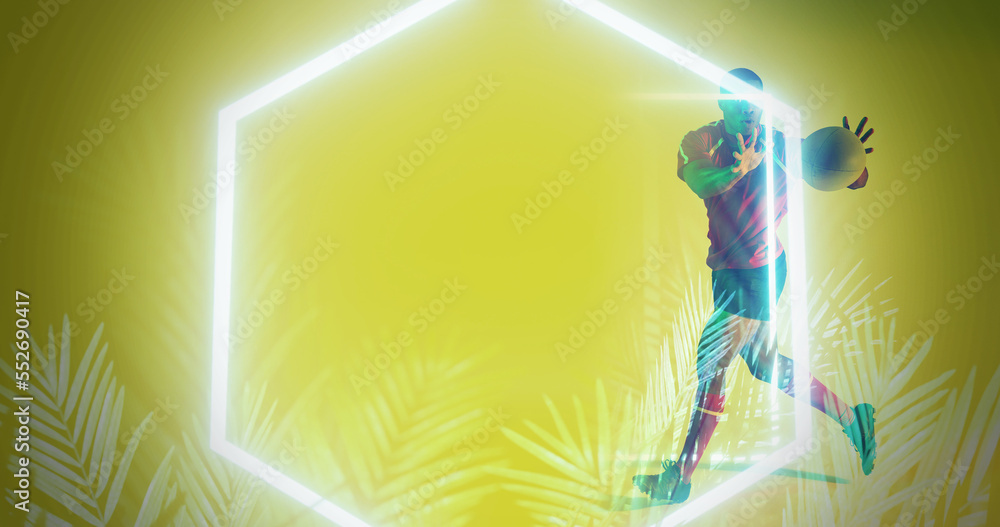 Illuminated hexagon and plants over african american rugby player catching ball on yellow background