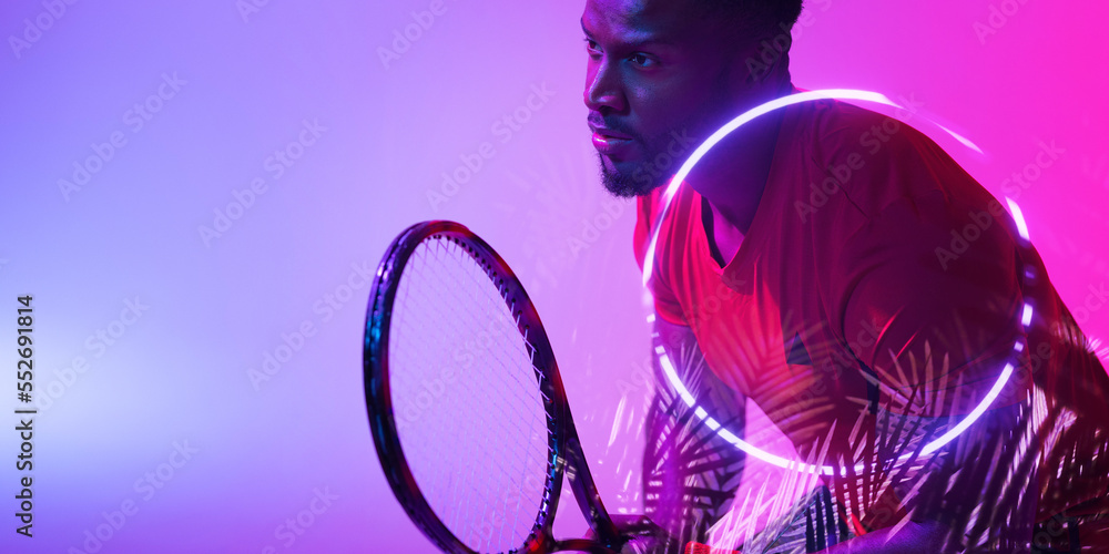 Circle and plants over african american male player holding tennis racket on colored background