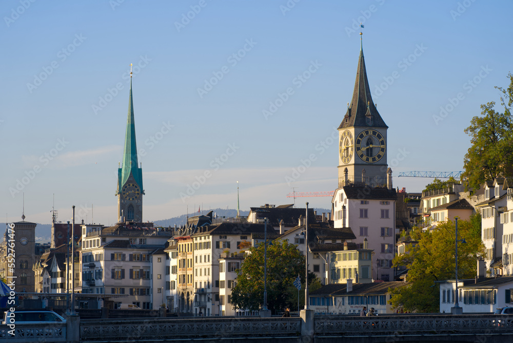 Beautiful cityscape of the old town of Zürich with church towers and Limmat River in the foreground 