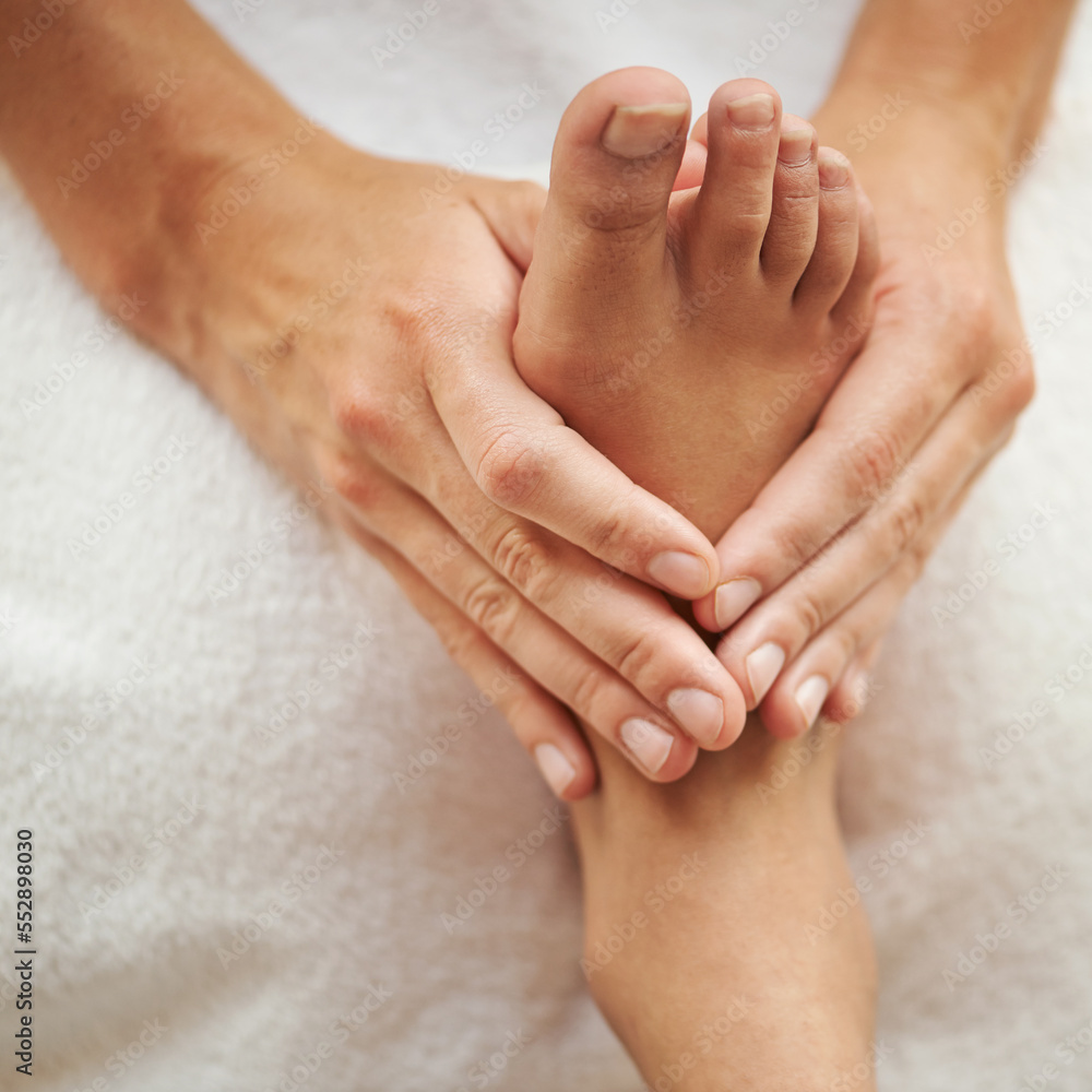 The perfect pedicure. Cropped shot of a womans foot being massaged.