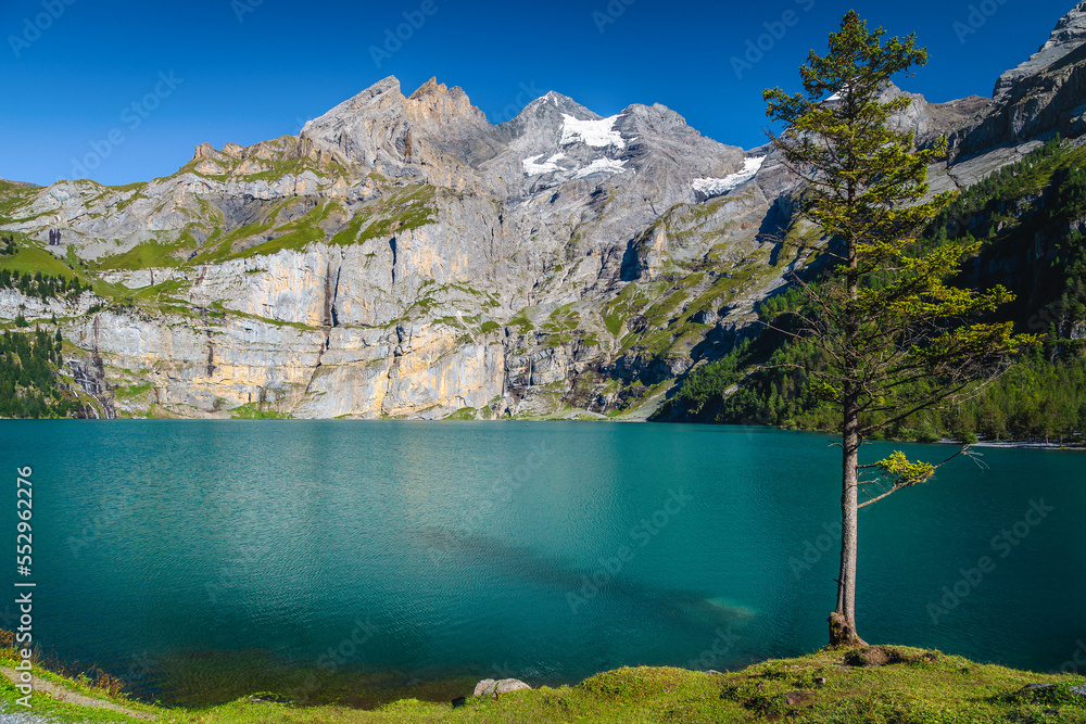 Oeschinensee alpine lake with beautiful high mountains and glaciers, Switzerland