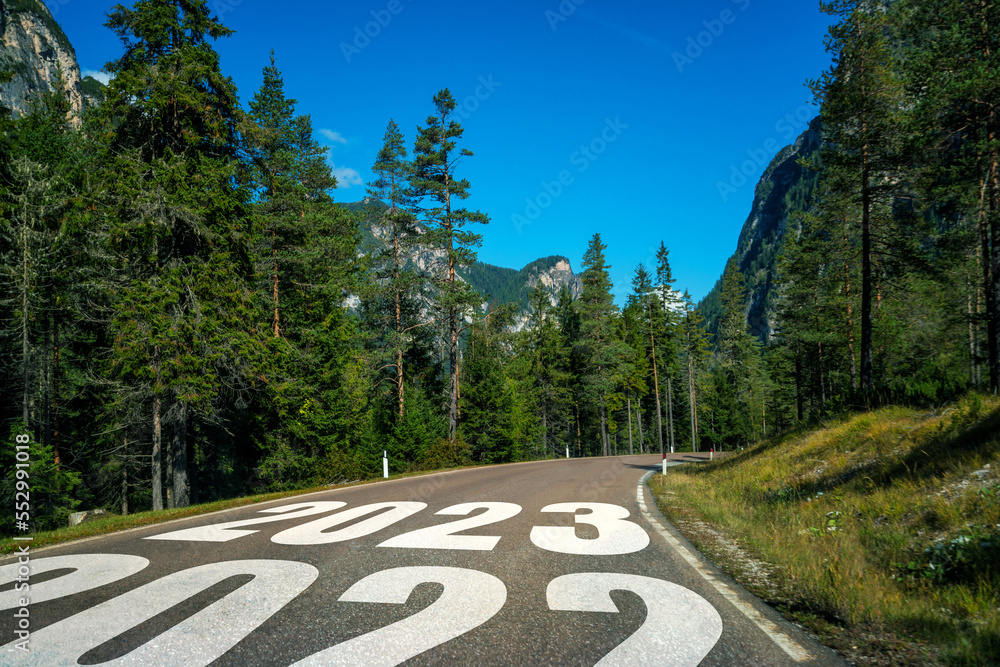 2023 New Year road trip travel and future vision concept . Nature landscape with highway road leadin