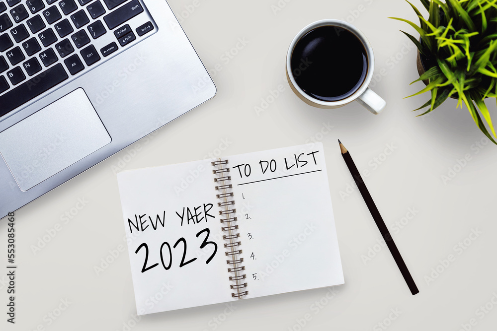 2023 Happy New Year Resolution Goal List and Plans Setting - Business office desk with notebook writ