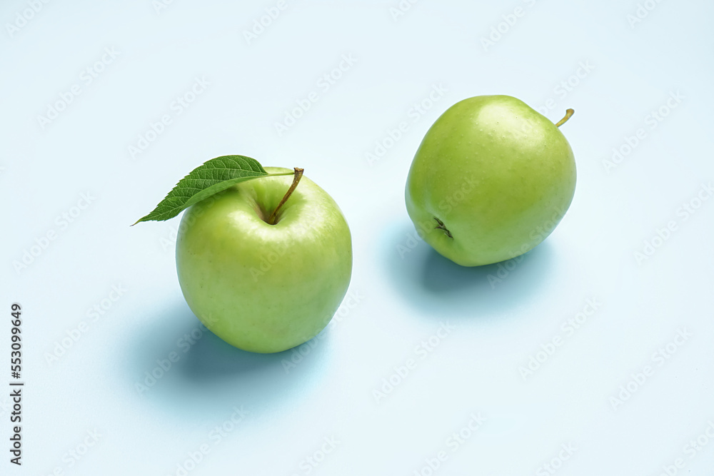 Ripe green apples on color background