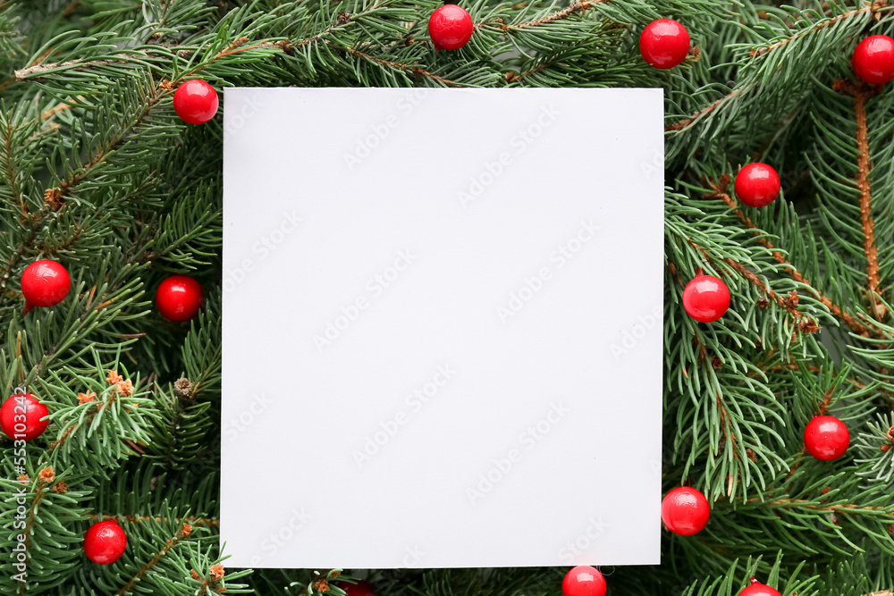 Blank paper sheet on Christmas branches with balls