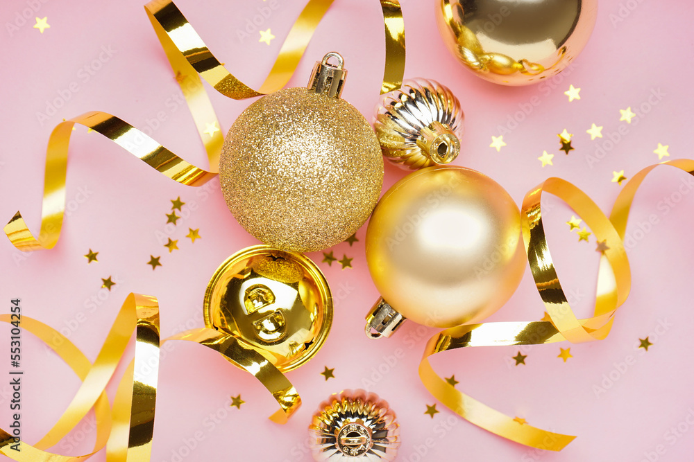 Composition with beautiful Christmas balls, serpentine and sequins on pink background, closeup