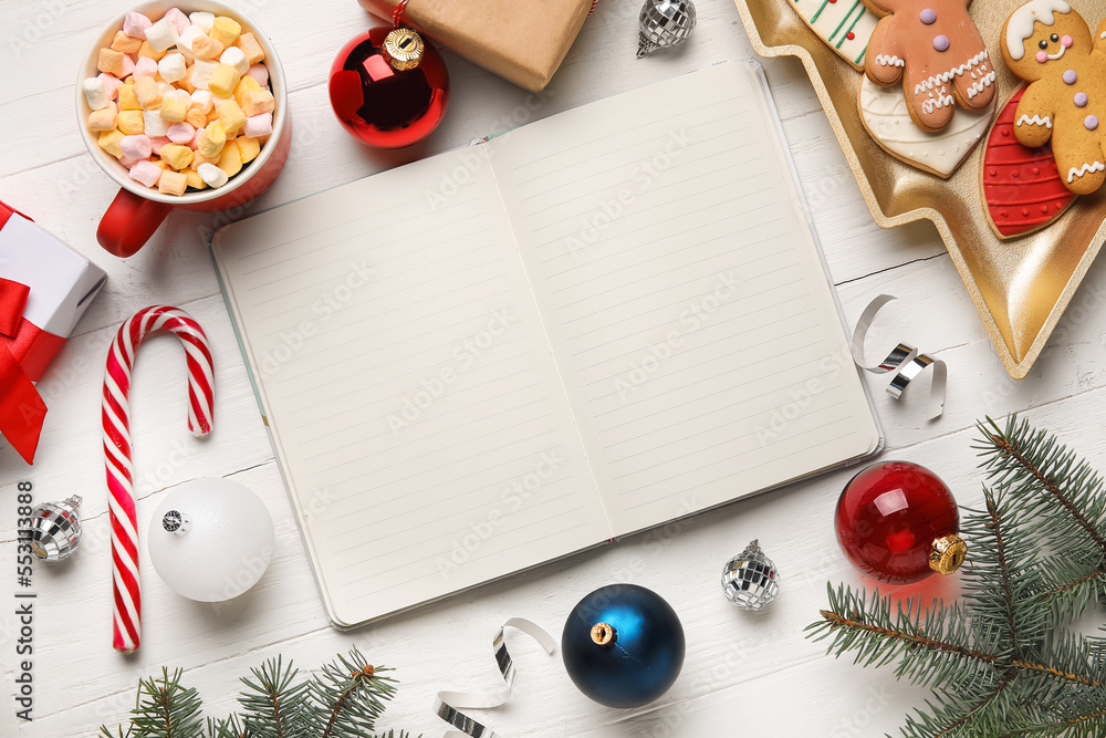 Blank notebook with Christmas decor, cup of cocoa and cookies on white wooden background