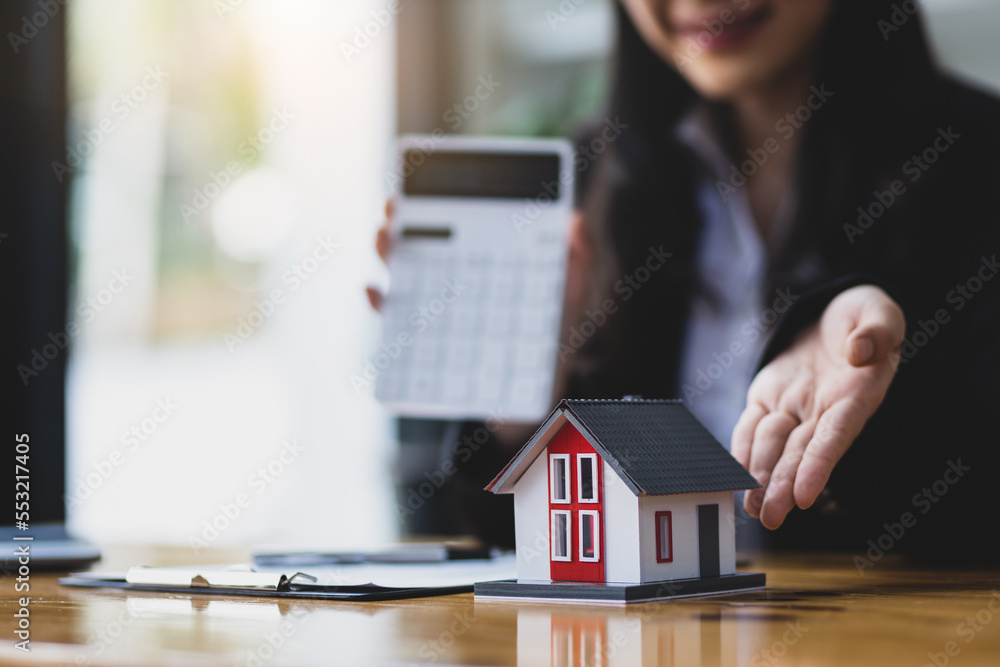 Real estate agent is showing a model home, The concept of buying and selling homes and rental homes.