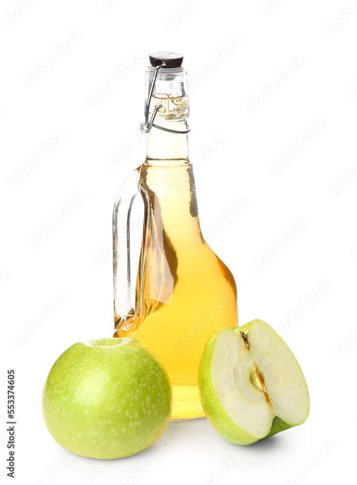 Bottle of fresh apple cider vinegar and fruits on white background