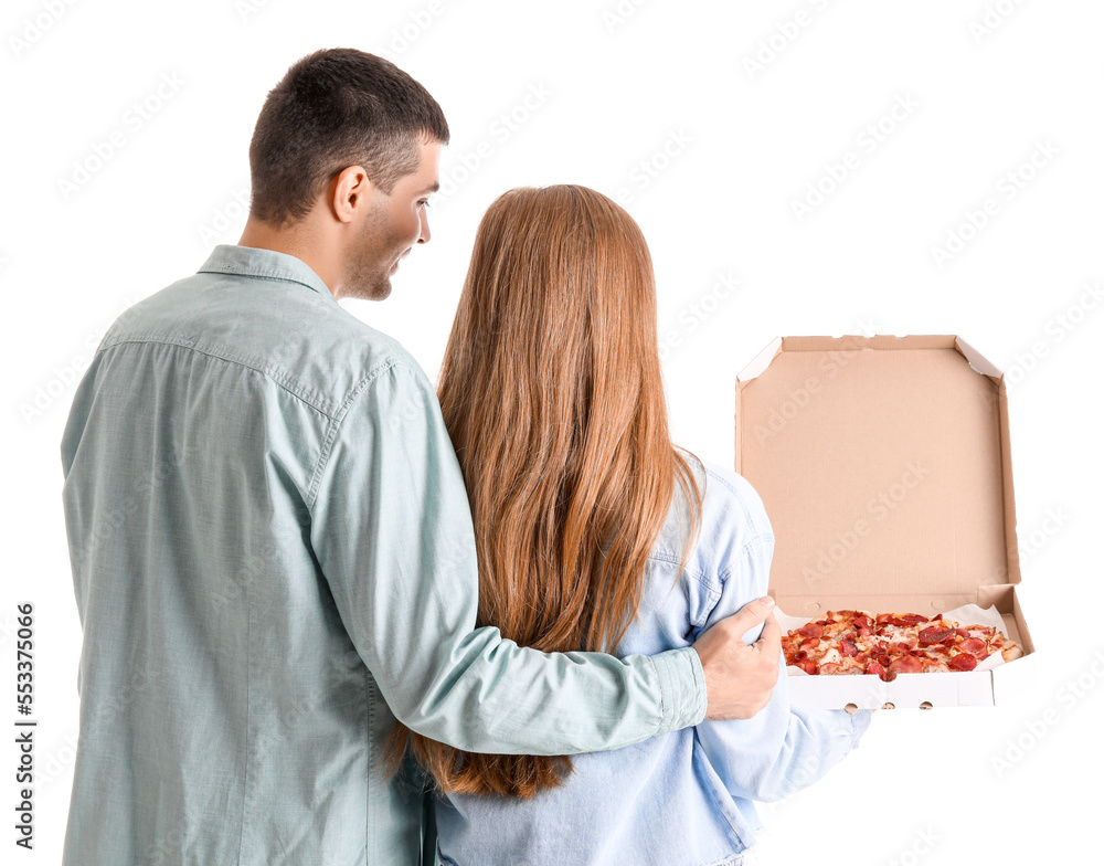 Happy young couple with fresh pizza on white background